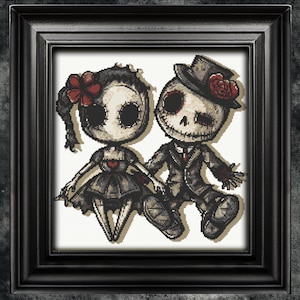 May include: A cross-stitch pattern featuring a couple of skeleton dolls dressed in wedding attire. The bride wears a black dress with a red flower in her hair, and the groom wears a black suit with a top hat and a red rose.