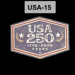 May include: A patriotic emblem with the text "USA 250" and the years "1776-2026". The design features stars, laurel wreaths, and a red, white, and blue color scheme, celebrating the United States' anniversary.