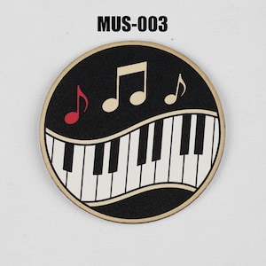May include: A circular emblem featuring the text MUS-003 at the top. The design displays a black background with a curved piano keyboard graphic in white and black. Above the keys are three musical notes in cream and one in red.