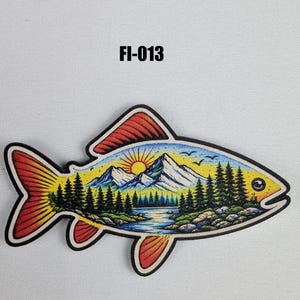 May include: A colorful fish-shaped sticker with a scenic landscape design. The design features a mountain range, a setting sun, trees, and a river. The sticker has a black border and the text "FI-013".
