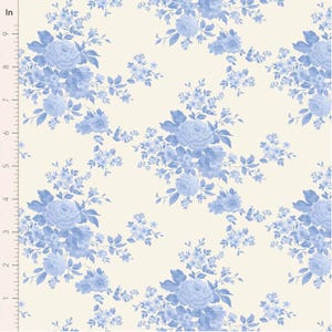May include: A fabric with a repeating floral pattern. The design features clusters of blue roses and smaller flowers with green leaves on a cream background. The pattern is measured in inches.