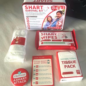 May include: A novelty "Shart Survival Kit" with a red and white tin, wipes, tissues, and a button. The kit includes items for dealing with unexpected situations. The tin reads "Shart Survival Kit" with a picture of a couple.