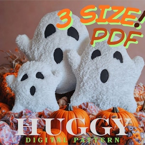 May include: Three white plush ghost figures with black oval eyes and mouths are displayed. The ghosts are surrounded by orange pumpkins and fall foliage. Text on the image reads "3 SIZE! PDF" and "HUGGY DIGITAL PATTERN".