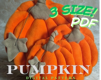 May include: Three plush orange pumpkins with tan stems and leaves. The pumpkins have a soft, textured appearance. The image includes the text "3 SIZE! PDF" and "PUMPKIN DIGITAL PATTERN".