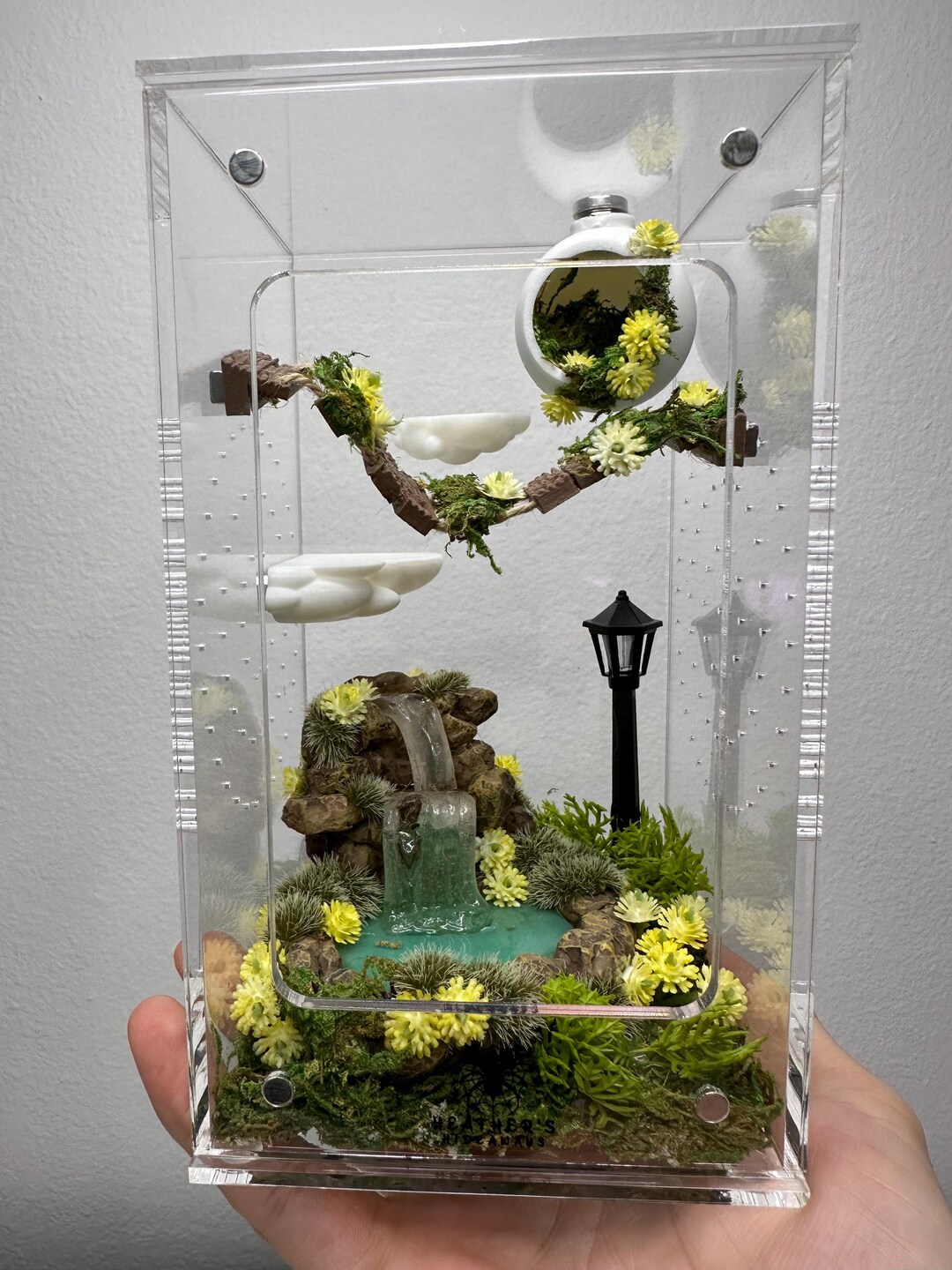 Beautiful view of Tropical Parrot Enclosure With Waterfall And Toys