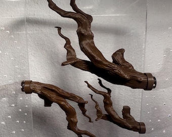 May include: Three brown, textured tree branch-shaped wall hooks or handles. Each piece features a realistic, gnarled bark appearance with a smooth, cylindrical mounting base at one end, designed for attachment to a flat surface.