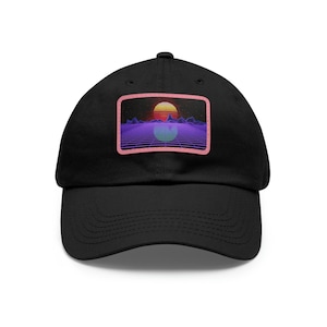 May include: Black baseball cap with a pink and purple retro sunset graphic on the front.