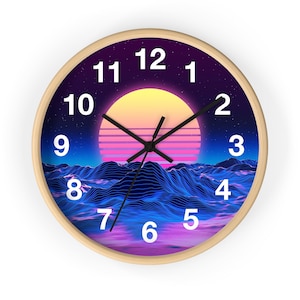 May include: A round wooden wall clock with a retro 80s design. The clock face features a purple and blue landscape with a pink and yellow sunset. The numbers 1 through 12 are displayed in white around the clock face.