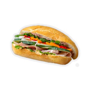 May include: A fresh sandwich with a crusty baguette, filled with layers of ham, cucumbers, carrots, onions, cilantro, and a creamy spread. The sandwich is cut in half, showcasing the colorful ingredients.