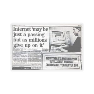 May include: A grayscale newspaper clipping with the headline "Internet 'may be just a passing fad as millions give up on it'". An image of a person using a computer is visible. The text "NOW THERE'S ANOTHER WAY INTELLIGENT FINANCE COULD MAKE YOU BETTER OFF" is also present.