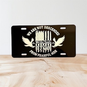 We The People, 1776.  Front License Plate, made of aluminum.  Great Quality; 12 x 6 inches