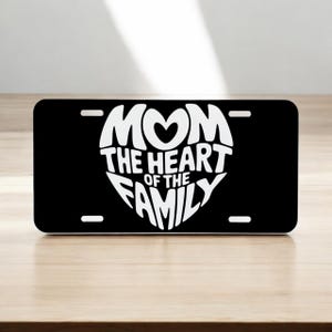 Mom the Heart of the Family.  Aluminum Laser Engraved Front License Tag/Plate.  Looks great on your car or truck!  Very Durable.