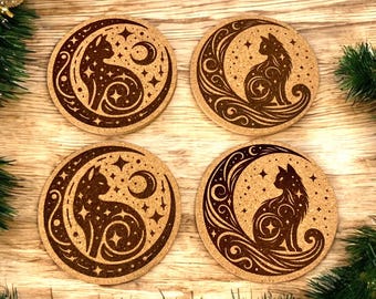 May include: Four round cork coasters with a cat and crescent moon design. The brown coasters feature a detailed illustration of a cat silhouette within a crescent moon, surrounded by stars and decorative swirls. Festive holiday decor surrounds the coasters.