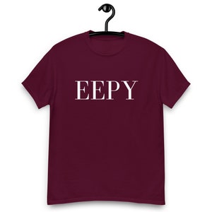 May include: A maroon t-shirt with the word "EEPY" printed in white on the front.