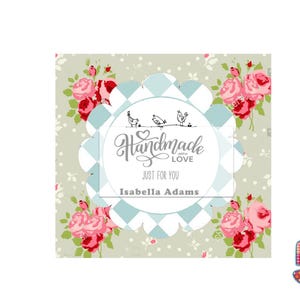 May include: A square label with a scalloped edge and a light blue and white checkered pattern. The label has the words "Handmade with Love JUST FOR YOU Isabella Adams" and is surrounded by pink roses on a light green background.