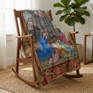 Nativity plush blanket draped over a wooden rocking chair
