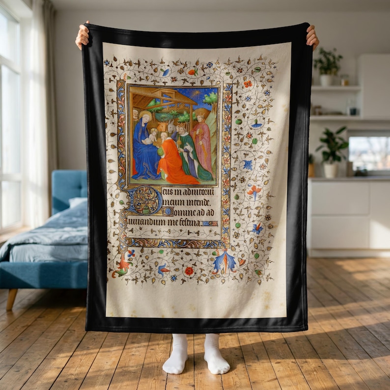 Nativity plush blanket held up to show its full size in a bright room