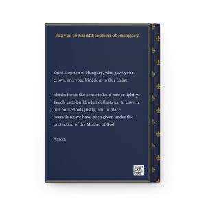 Photograph of St. Stephen of Hungary lined journal, with the prayer typeset on the back cover, navy and gold fleur-de-lis spine, back cover