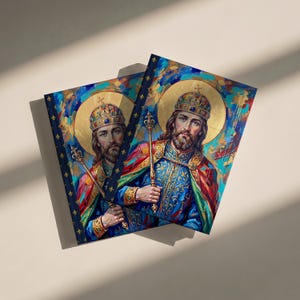 Photograph of St. Stephen of Hungary lined journal, with the prayer typeset on the back cover, navy and gold fleur-de-lis spine, two journals