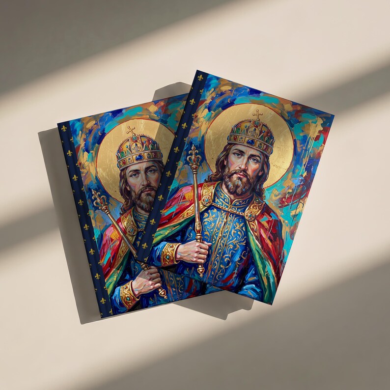 Photograph of St. Stephen of Hungary lined journal, with the prayer typeset on the back cover, navy and gold fleur-de-lis spine, two journals
