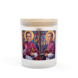 Frosted glass 11 oz candle with a wooden lid, featuring a printed label showing two painted portrait views of Blessed Archbishop Fulton J. Sheen in magenta vestments with a gold halo, holding a book and rosary