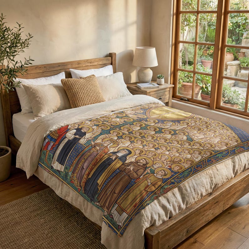 All Saints plush blanket spread over a wooden bed beside a sunlit garden window