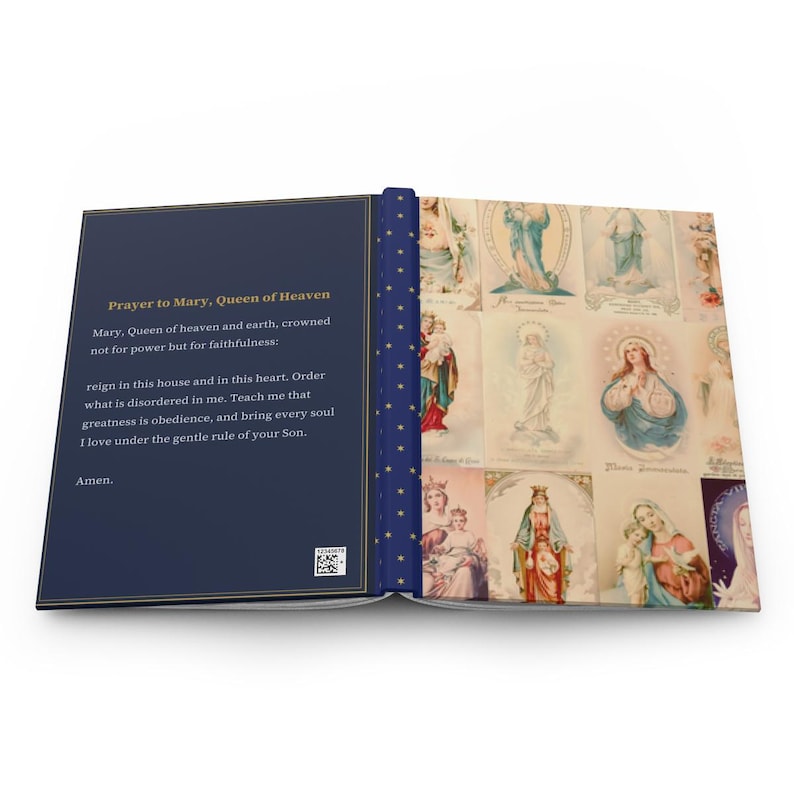 Close view of Queenship of Mary lined journal, with the prayer typeset on the back cover, navy and gold star spine, cover