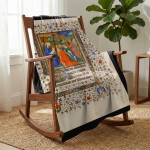 Nativity plush blanket draped over a wooden rocking chair