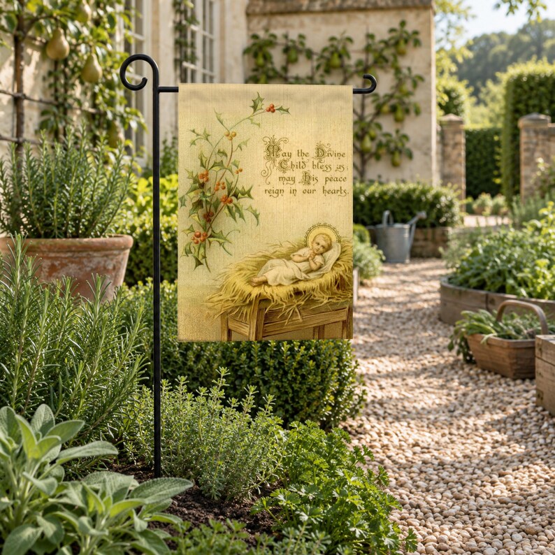 Nativity garden flag on a garden stand beside a gravel path through an herb garden