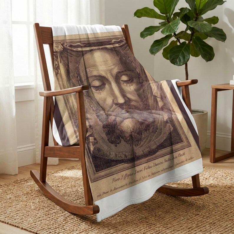Holy Face plush blanket draped over a wooden rocking chair