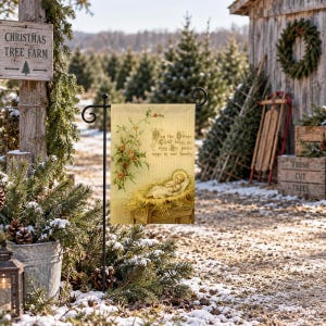 Nativity garden flag on a garden stand at a snowy Christmas tree farm