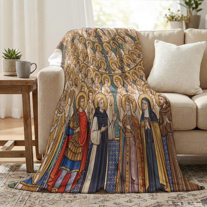 All Saints plush blanket draped over the arm of a cream sofa