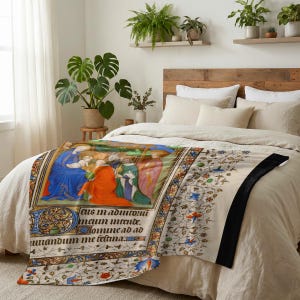 Nativity plush blanket spread across the foot of a bed with a wooden headboard