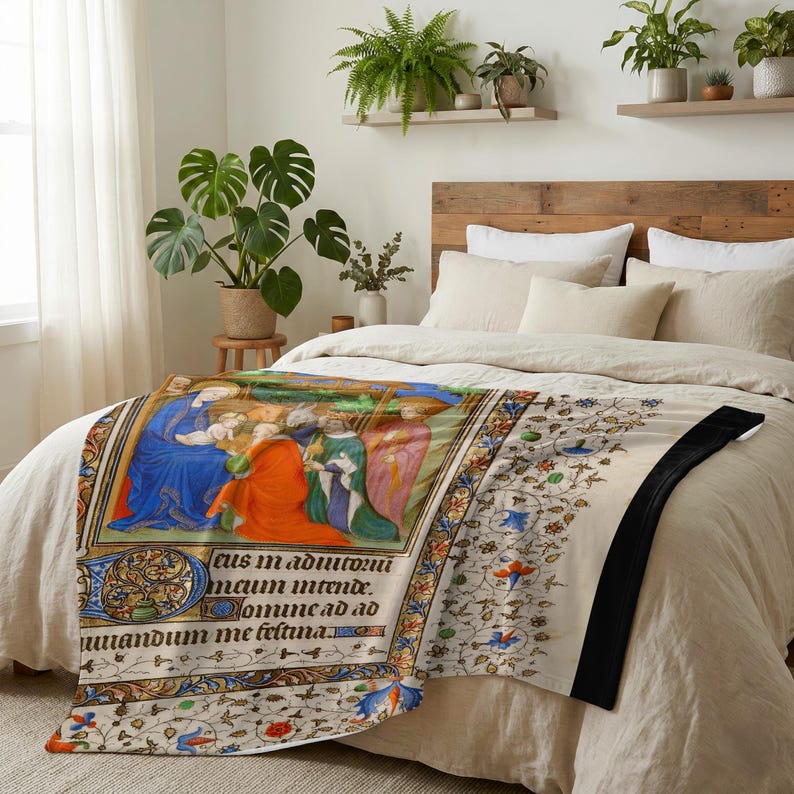 Nativity plush blanket spread across the foot of a bed with a wooden headboard