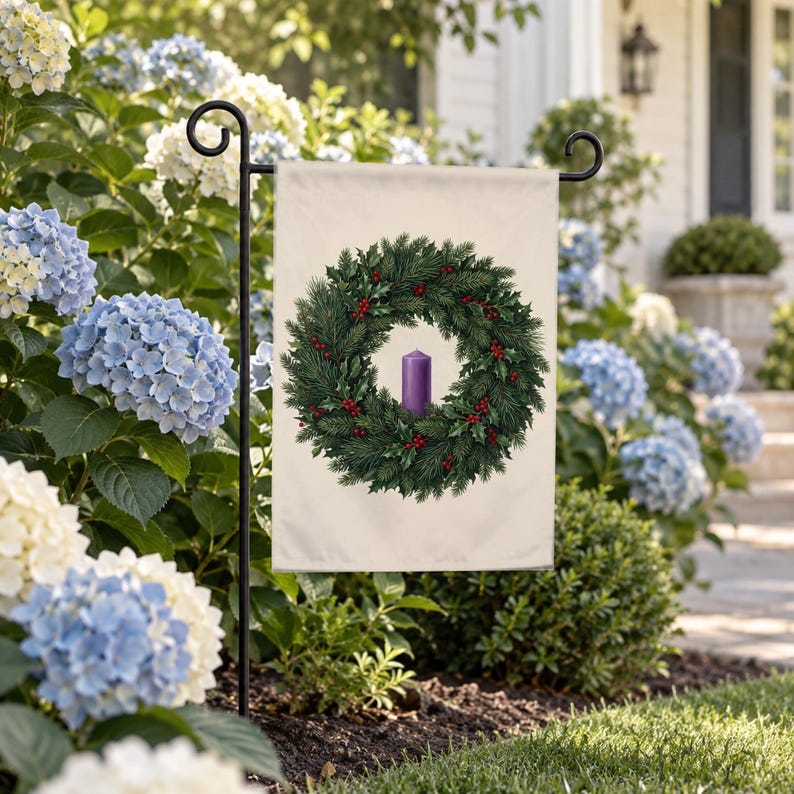 Advent garden flag on a garden stand among blue and white hydrangeas beside a front walk