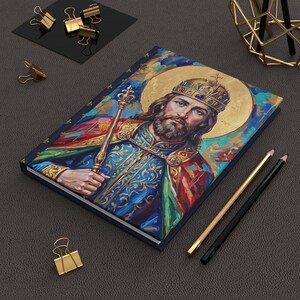 Detail of St. Stephen of Hungary lined journal, with the prayer typeset on the back cover, navy and gold fleur-de-lis spine, harvested