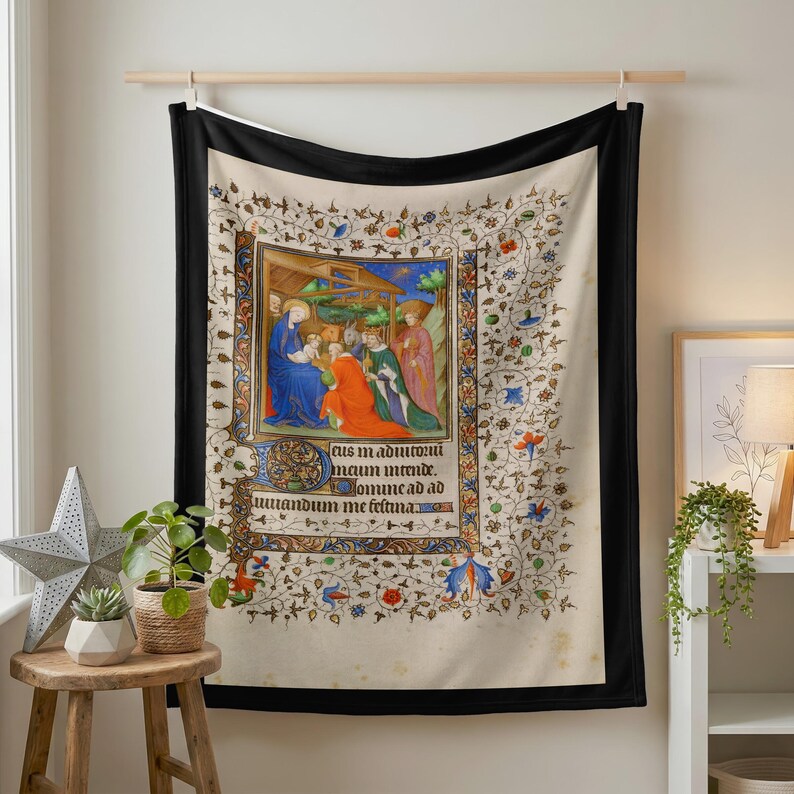 Nativity plush blanket hung on a wall from a wooden rod above a small plant stand