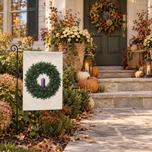 Advent garden flag on a garden stand by porch steps with pumpkins, mums and an autumn wreath