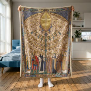 All Saints plush blanket held up to show its full size in a bright room