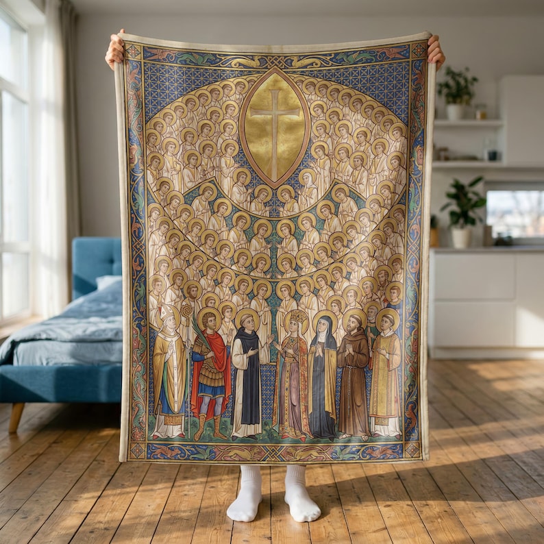 All Saints plush blanket held up to show its full size in a bright room