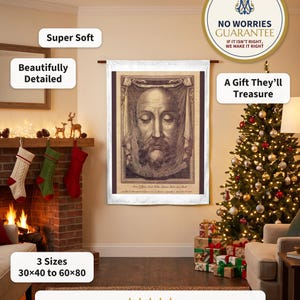 Holy Face plush blanket hung flat beside a stone fireplace on Christmas Eve, a Nativity on the mantel and wrapped gifts below
