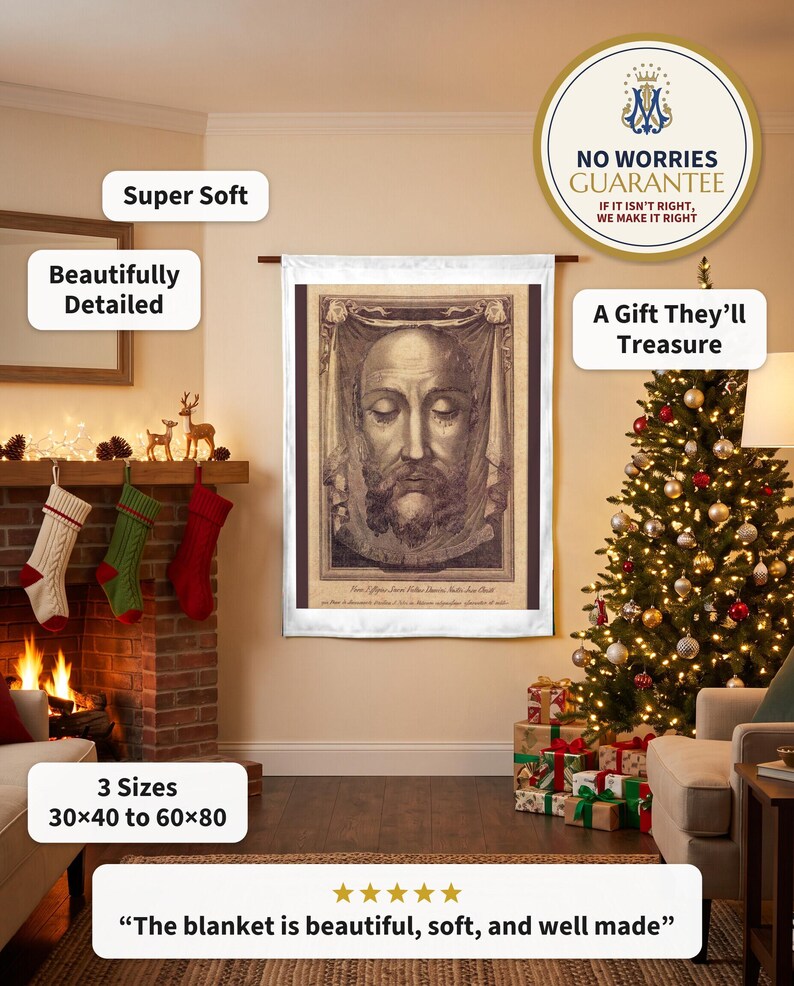Holy Face plush blanket hung flat beside a stone fireplace on Christmas Eve, a Nativity on the mantel and wrapped gifts below