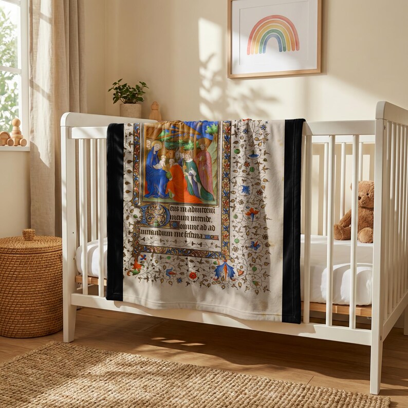 Nativity plush blanket hung over the rail of a white crib with a teddy bear inside