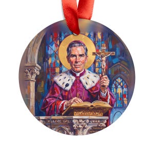 Round white acrylic ornament featuring illustrated artwork of Blessed Archbishop Fulton J. Sheen in purple vestments holding a crucifix at a pulpit, with a golden halo and stained glass background, hung with a red ribbon
