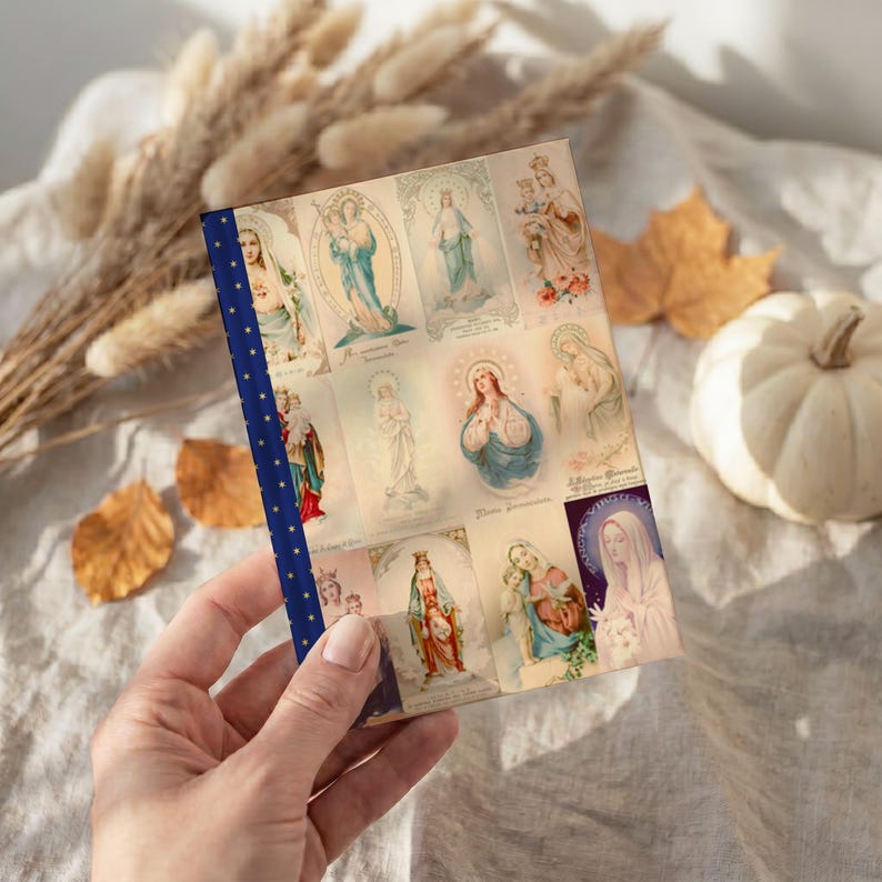View of Queenship of Mary lined journal, with the prayer typeset on the back cover, navy and gold star spine, halloween interior