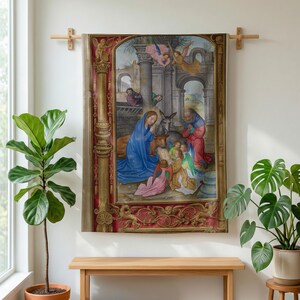 Nativity plush blanket hung on a wall from a wooden rod above a bench, between potted plants