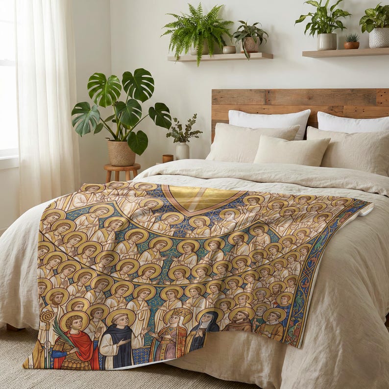 All Saints plush blanket spread across the foot of a bed with a wooden headboard