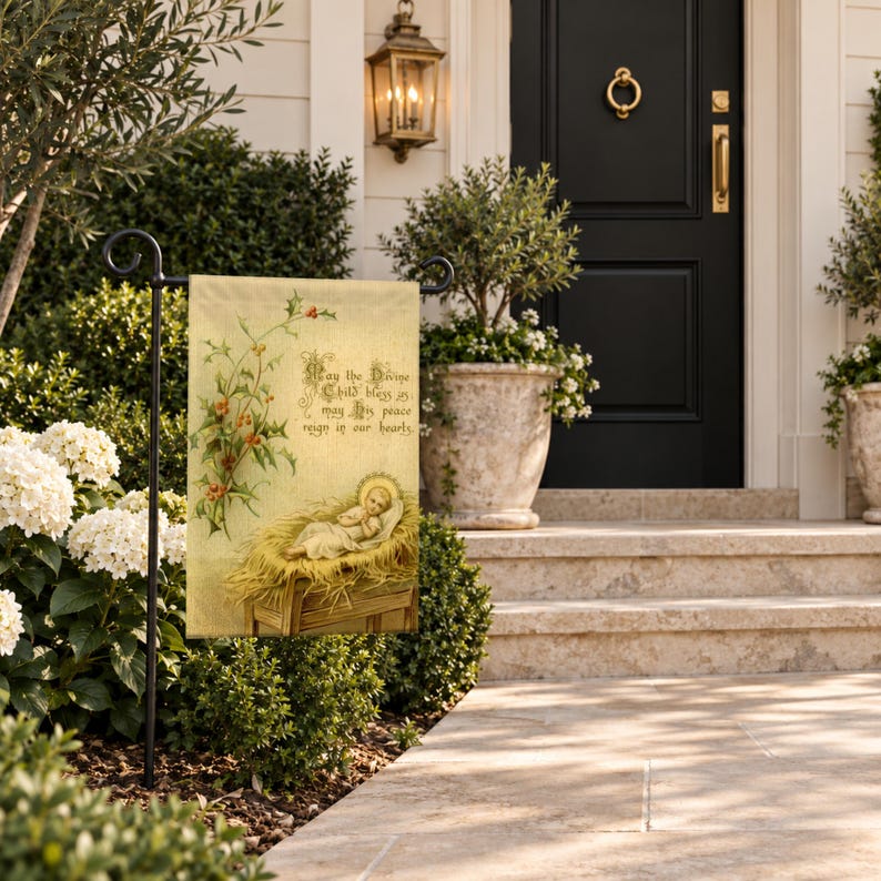 Nativity garden flag on a garden stand beside stone steps up to a black front door