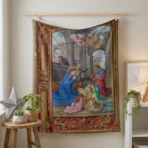 Nativity plush blanket hung on a wall from a wooden rod above a small plant stand
