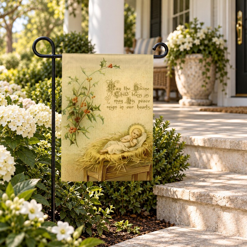Nativity garden flag on a garden stand among white flowers beside stone porch steps